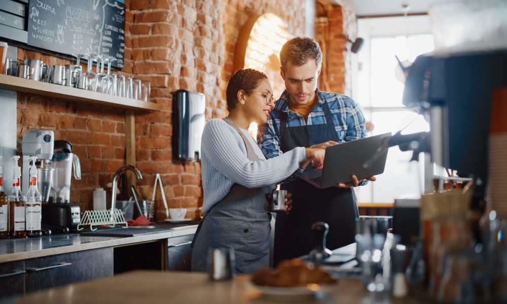 two restaurant workers with tablet